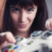 Girl playing videogames in a funny face