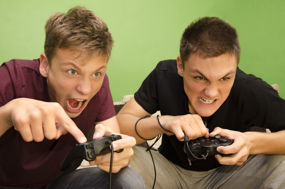 two guys boys playing video games