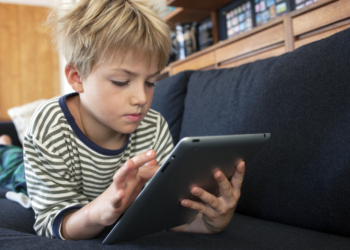 child playing on tablet 1