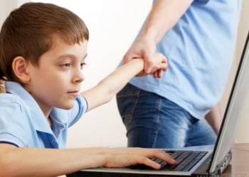 man dragging kid off computer