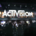 Attendees walk past Activision Blizzard Inc. signage during the E3 Electronic Entertainment Expo in Los Angeles, California, U.S., on Wednesday, June 14, 2017. Photographer: Patrick T. Fallon/Bloomberg