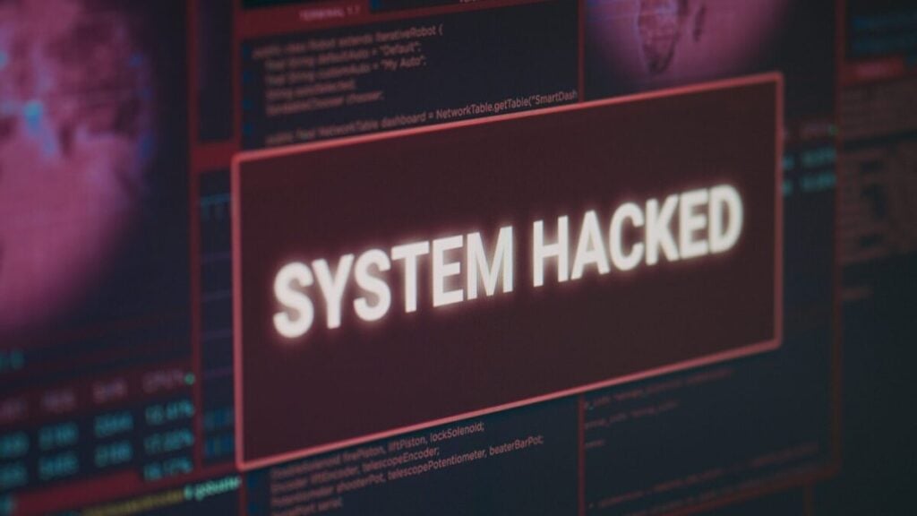 Computer Monitor Showing Hacked System Alert Message Flashing Screen Dealing With Hacking Cyber Crime Attack Display With Security Breach Warning Malware Threat Close Up 1920x1080